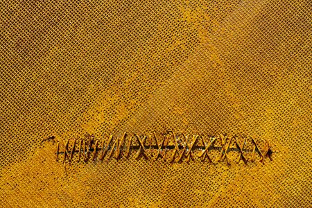 Yellow net. Wired hole. Texture of yellow surface.