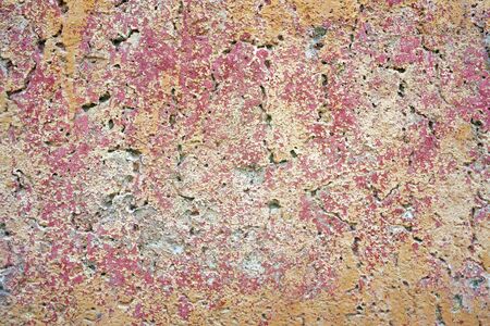 Red and orange paint on the wall of a house. Construction and repair.の写真素材