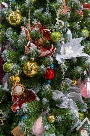 Christmas decorations on branches of green spruce. Christmas holiday.の写真素材