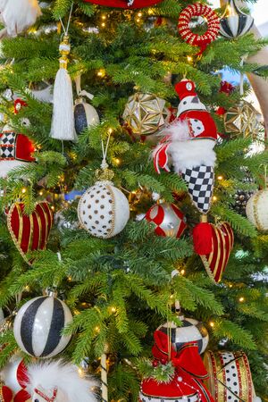 Christmas decorations on branches of green spruce. Christmas holiday.の写真素材