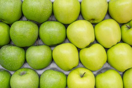 Ripe green apples. Harvest of autumn in the store.の写真素材