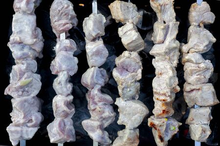 Grilled raw meat. Cooking outdoors.の写真素材
