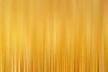Abstract vertical yellow lines background. Streaks are blurry in motion.の写真素材