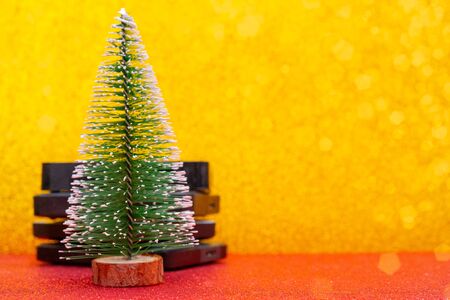 Festive Christmas tree and computer hard drives for data storage.の写真素材
