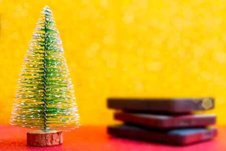 Festive Christmas tree and computer hard drives for data storage.の写真素材