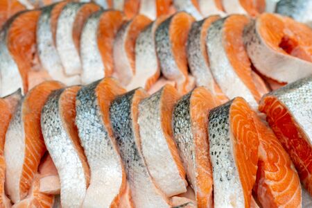 Steaks of fresh salmon. Sale on ice. Seafood shop.の写真素材