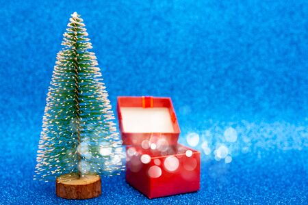 Christmas tree and gift box. Festive christmas background.の写真素材