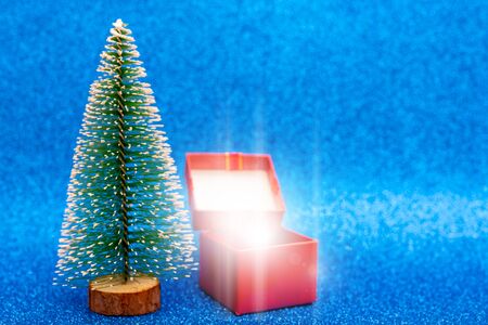Christmas tree and gift box. Festive christmas background.の写真素材