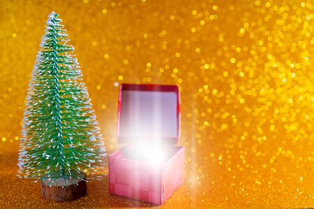 Christmas tree and gift box. Festive christmas background.の写真素材