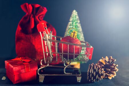 Christmas toys and gifts on a shiny dark background.の写真素材