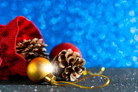Christmas blue background. Red gift bag and Christmas toys.の写真素材