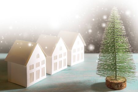 Christmas snowfall in small village. Christmas tree.の写真素材