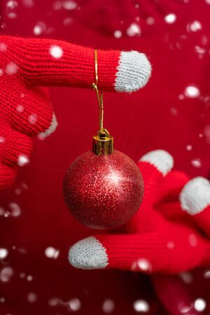Christmas decoration - shiny red ball. Festive composition.の写真素材