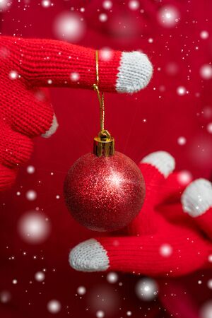Christmas decoration - shiny red ball. Festive composition.の写真素材