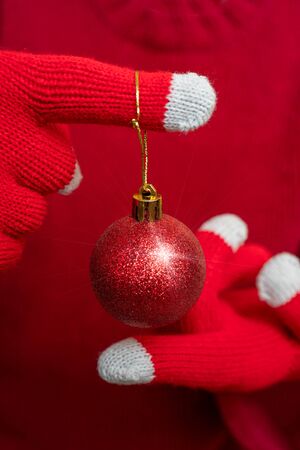 Christmas decoration - shiny red ball. Festive composition.の写真素材