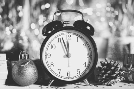 Christmas composition. Watches, gift boxes, cones and Christmas toys on shiny background. Copy space.の写真素材