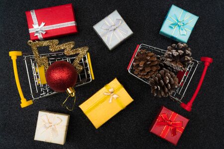Christmas toys and gifts on shiny dark background.の写真素材
