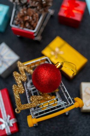 Christmas toys and gifts on shiny dark background.の写真素材