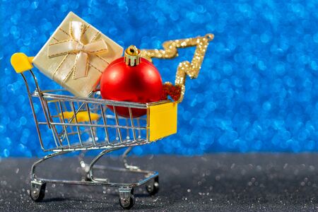 Christmas toys and gifts on shiny dark background.の写真素材