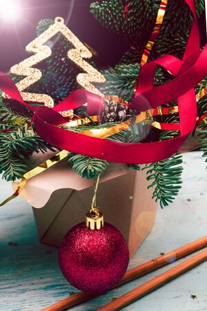 Christmas composition. Wok paper box. Christmas tree and decorations.の写真素材