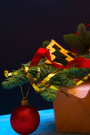 Christmas composition. Wok paper box. Christmas tree and decorations.の写真素材