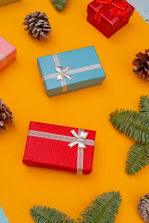Christmas composition. Christmas gift boxes, fir cones and branches of spruce. Holiday greeting card background.の写真素材