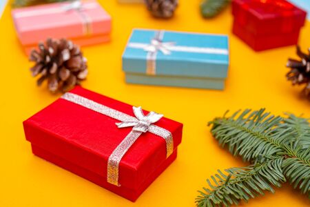 Christmas composition. Christmas gift boxes, fir cones and branches of spruce. Holiday greeting card background.の写真素材