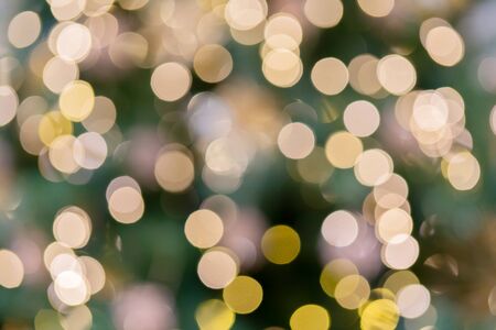 Abstract festive blurry background. Beautiful bokeh. Camera lenses effect. Round spots of light.の写真素材