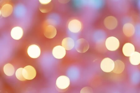 Abstract festive blurry background. Beautiful bokeh. Camera lenses effect. Round spots of light.の写真素材
