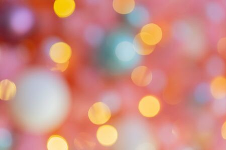 Abstract festive blurry background. Beautiful bokeh. Camera lenses effect. Round spots of light.の写真素材