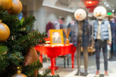 Moscow. Russia. December 2, 2019. Mannequins in a shop window. Christmas window dressing.の写真素材