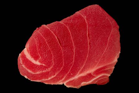 Tuna fillet on black background. Seafood cooking. Useful and tasty food.の写真素材