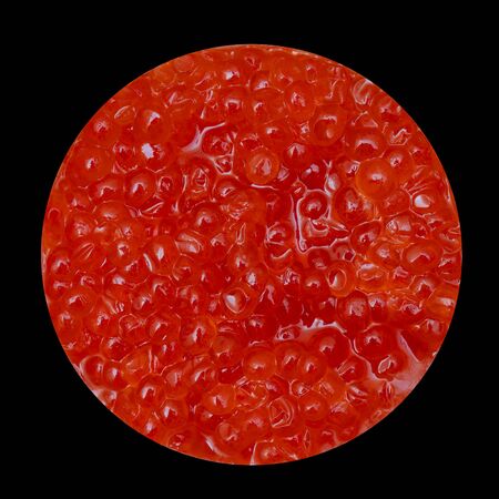 Fresh red caviar on black background. Natural texture. Sea products.の写真素材