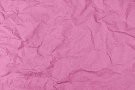 Pink crumpled craft paper. Paper surface texture.の写真素材
