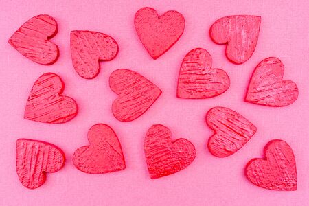Red hearts on an abstract pink background. Holiday valentine's day greeting card.の写真素材