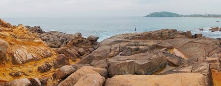 Large stones on the shore of the Indian Ocean.の写真素材