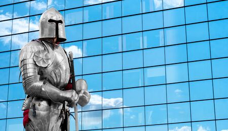 Knight in shiny metal armor. Reliable security and insurance. Copy space.
