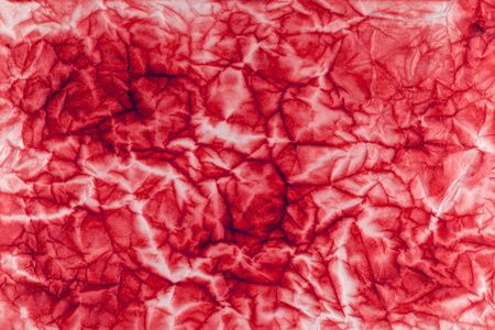 Old crumpled shabby red paper. Paper surface texture.の写真素材