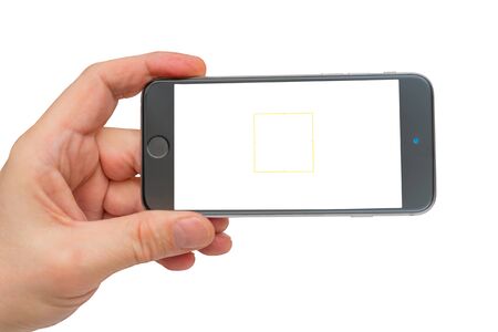 Smartphone in man's hand on transparent background. Smartphone photography.