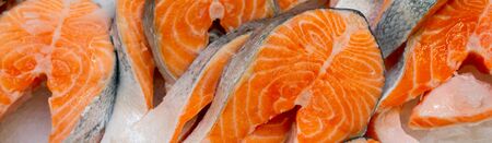 Fresh salmon steaks. Seafood sale in a store. Showcase fish store.