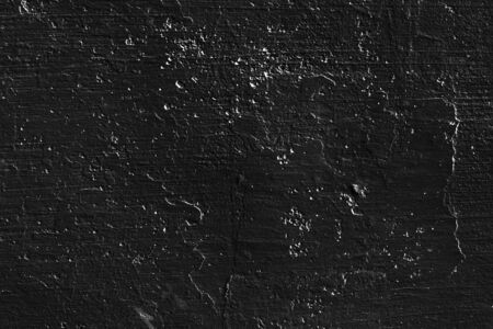 Abstract black background. Black stucco texture. Dark rough surface.