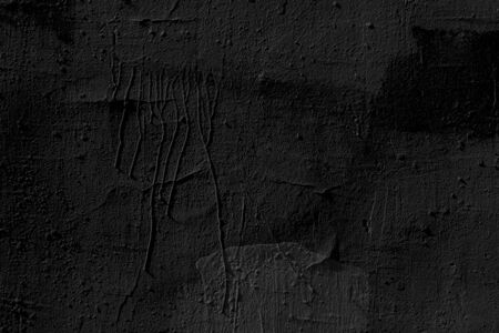 Abstract black background. Black stucco texture. Dark rough surface.の写真素材