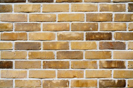Yellow brick wall. Facade of an old building. Architectural background.の写真素材