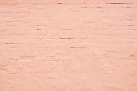 Pink stucco texture. Architectural abstract background. Pink wall of building.の写真素材