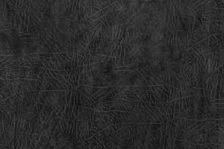 Black leather texture. Abstract dark background. Rough surface.の写真素材