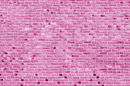 Old vintage pink brick wall textured background.の写真素材
