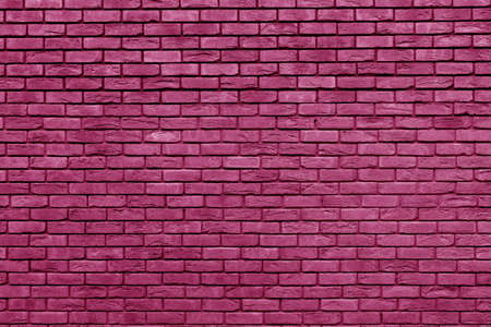 Pink brick wall. Loft interior design. Pink paint of the facade. Architectural background.の写真素材