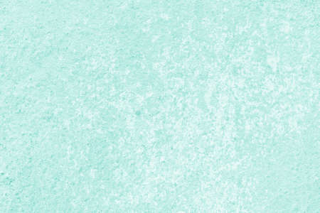 Green wall of the building. Rough plaster surface. Abstract background.
