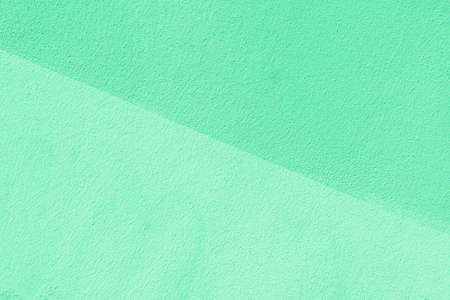 Texture of green plaster. Interior of a modern loft. Abstract rough background. The facade of an old...