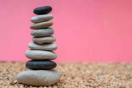 Stack of pebbles in an unstable state. A pyramid made of flat stones.の写真素材